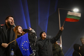 EU flags during an anti-government demonstration in Sofia on December 10, 2025. Tens of thousands of people held anti-government protests in Bulgaria on December 10, 2025 widening an anti-corruption movement sweeping the European Union's poorest country as it prepares to adopt the euro. (Photo by DIMITAR KYOSEMARLIEV / AFP)
