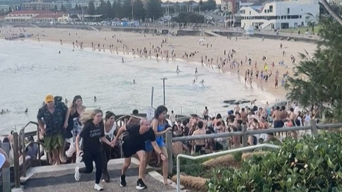 This screen grab of UGC video taken on December 14, 2025 and received courtesy of Mike Ortiz shows beach-goers fleeing Bondi Beach after gunmen opened fire, in Sydney on December 14, 2025. (AFP) This screen grab of UGC video taken on December 14, 2025 and received courtesy of Mike Ortiz shows beach-goers fleeing Bondi Beach after gunmen opened fire, in Sydney on December 14, 2025. (AFP)