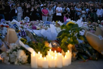 Mourners gather at a tribute at the Bondi Pavillion in memory of the victims of a shooting at Bondi Beach, in Sydney on December 15, 2025. (AFP)