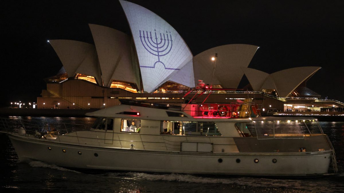 A Hanukkah menorah is projected onto the sails of the Sydney Opera House in memory of the victims of a shooting at Bondi Beach, in Sydney on December 15, 2025. (AFP) A Hanukkah menorah is projected onto the sails of the Sydney Opera House in memory of the victims of a shooting at Bondi Beach, in Sydney on December 15, 2025. (AFP)