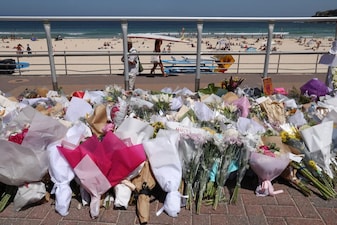 Floral tributes left by mourners are seen at the promenade of Bondi Beach in Sydney to honour victims of the shooting that took place there on December 14. File image/AFP