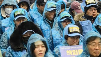 Family members of victims of South Korea's deadliest plane crash on home soil gather for a rally in Seoul on December 20, 2025, ahead of the first anniversary of the December 29, 2024 Air Jeju plane crash, when a Boeing 737-800 was flying from Thailand to South Korea's southwest but ended up belly-landing at Muan airport and exploding in a fireball after slamming into a concrete structure, killing 179 people. (Photo by ANTHONY WALLACE / AFP)