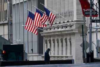 A security guard is seen next to a road block near the New York Stock exchange in the Financial District. File image/AP