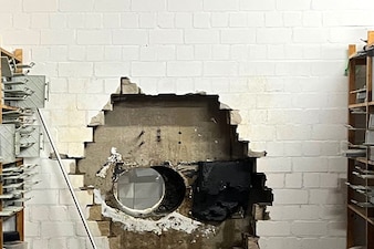 This picture, provided by the Gelsenkirchen Police shows a hole in a wall of the savings bank branch in the Buer district in Gelsenkirchen, Germany. AP 