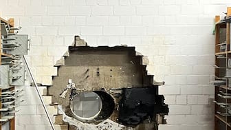 This picture, provided by the Gelsenkirchen Police shows a hole in a wall of the savings bank branch in the Buer district in Gelsenkirchen, Germany. AP 
