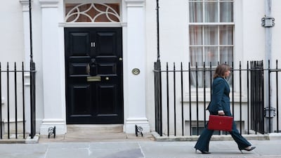 British Chancellor of the Exchequer Rachel Reeves walks with the red budget box, outside 11 Downing Street in London, Britain, on November 26, 2025. Reuters
