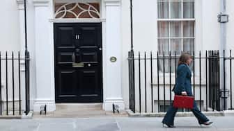 British Chancellor of the Exchequer Rachel Reeves walks with the red budget box, outside 11 Downing Street in London, Britain, on November 26, 2025. Reuters