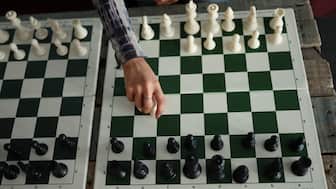 Chess pieces and boards at a tournament. Image: Reuters