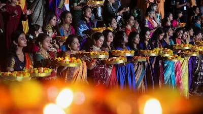 Devotees pray during the festival of Dev Diwali in Mumbai, India, November 5, 2025. File Image/Reuters