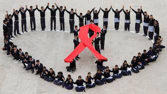 Students make a formation in the shape of a heart and a red ribbon during a HIV/AIDS awareness campaign on Valentine's Day in the northern Indian city of Chandigarh February 14, 2012. (Photo: Ajay Verma/Reuters) 