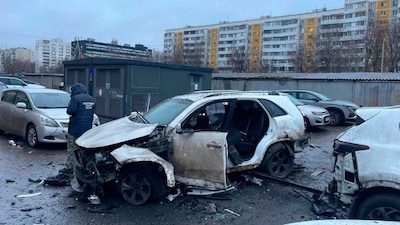 The photograph shows an investigator working at the scene where Lieutenant General Fanil Sarvarov was killed when his car exploded in Moscow, Russia, on December 22, 2025. (Photo: Investigative Committee of Moscow via AP)