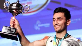 India’s Lakshya Sen holds the trophy after defeating Japan’s Yushi Tanaka in the men's singles final match at the Australia Open badminton tournament in Sydney on November 23, 2025. AFP