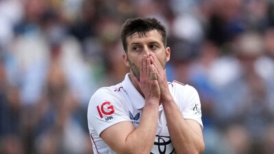 Mark Wood bowled 11 wicketless overs in the Ashes opener in Perth before missing the day-night Test in Brisbane due to a problematic knee. Reuters