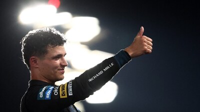 Britain's Lando Norris celebrates after winning the 2025 Formula 1 Driver's Championship by finishing third at the Abu Dhabi Grand Prix. Reuters