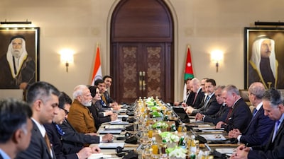 Prime Minister Narendra Modi with Jordan's King Abdullah II ibn Al Hussein and others during delegation level talks, in Amman, Jordan. PTI