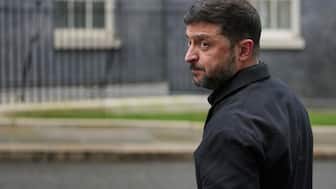 FILE - Ukrainian President Volodymyr Zelenskyy, looks back at the media in Downing Street, London, Monday, Dec. 8, 2025. (AP Photo/Kin Cheung, File)
