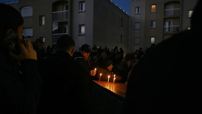 Mourners attend a tribute to Frenchman Dan Elkayam, one of the victims killed during a shooting at an event for the Jewish festival of Hanukkah on Bondi Beach in Sydney, in Le Bourget, northern France, on December 16, 2025.- AFP