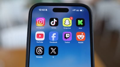Instagram, TikTok, Snapchat, Kick, YouTube, Facebook, Twitch, Reddit, Threads and X applications are displayed on a mobile phone, in this picture illustration taken on December 9, 2025. File Image/Reuters