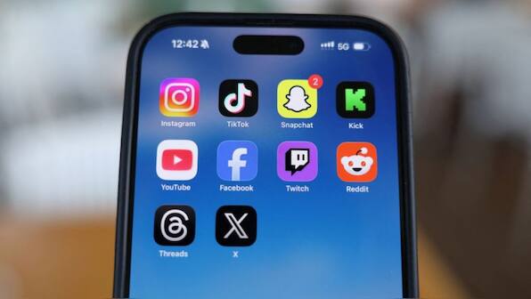 general Instagram, TikTok, Snapchat, Kick, YouTube, Facebook, Twitch, Reddit, Threads and X applications are displayed on a mobile phone, in this picture illustration taken on December 9, 2025. File Image/Reuters