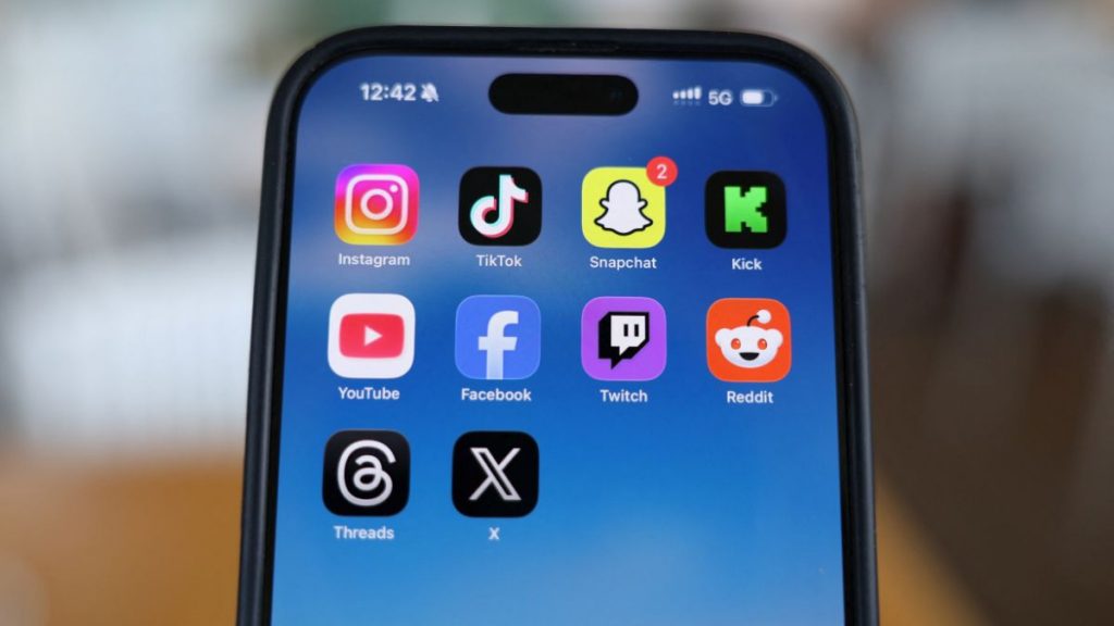 general Instagram, TikTok, Snapchat, Kick, YouTube, Facebook, Twitch, Reddit, Threads and X applications are displayed on a mobile phone, in this picture illustration taken on December 9, 2025. File Image/Reuters