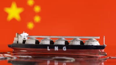 Model of LNG tanker is seen in front of China's flag in this illustration taken May 19, 2022. (Reuters)
