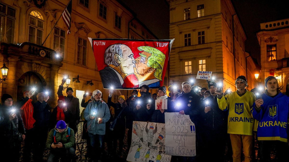 Protesters display a banner with caricatures of Russian President Vladimir Putin and US President Donald Trump as people demonstrate against a plan drafted by the US President Donald Trump's administration to end the war in Ukraine during a protest rally called "No to Munich 2025. Do not sell out Ukraine", in front of the US Embassy in Prague, Czech Republic, November 25, 2025. File Image/Reuters Protesters display a banner with caricatures of Russian President Vladimir Putin and US President Donald Trump as people demonstrate against a plan drafted by the US President Donald Trump's administration to end the war in Ukraine during a protest rally called "No to Munich 2025. Do not sell out Ukraine", in front of the US Embassy in Prague, Czech Republic, November 25, 2025. File Image/Reuters