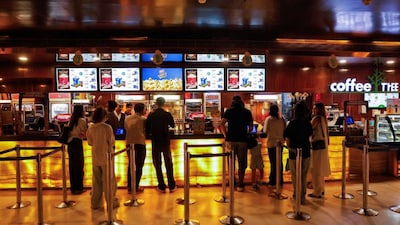 People purchase snacks at a multiplex cinema hall. File photo/REUTERS
