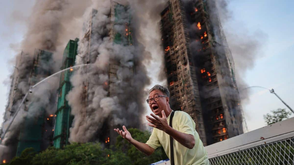 The story of the photo that’s become synonymous with the deadly Hong Kong fire
