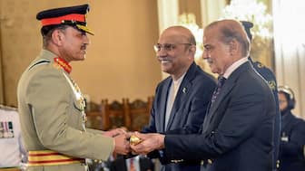 Pakistan's Prime Minister Shehbaz Sharif (R) and President Asif Ali Zardari (C) jointly conferring the Baton of Field Marshal on Chief of Army Staff General Syed Asim Munir during a ceremony at the country's President House in Islamabad on May 22, 2025. File Photo/Pakistan's Press Information Department (PID)/via AFP