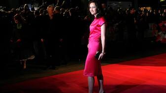 British author Sophie Kinsella poses for photographers as she arrives for the British premiere of the film "Confessions of a Shopaholic" at Leicester Square in London February 16, 2009. Reuters.