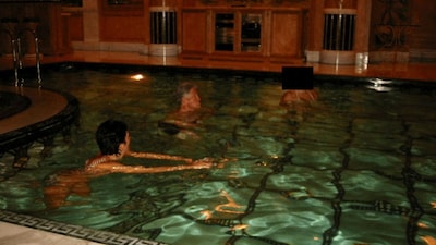 Former U.S. President Bill Clinton swims in a pool in this image released by the Department of Justice in Washington, D.C., U.S., on December 19, 2025 as part of a new trove of documents from its investigations into the late financier and convicted sex offender Jeffrey Epstein. U.S. Justice Department/Handout via Reuters