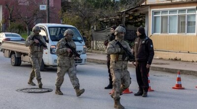 Turkish special forces team leaves the site where Turkish security forces launched an operation on a house believed to contain suspected Islamic State militants.(Reuters)