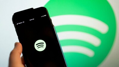 This illustration photo shows the Spotify logo on a smartphone. File photo/AFP