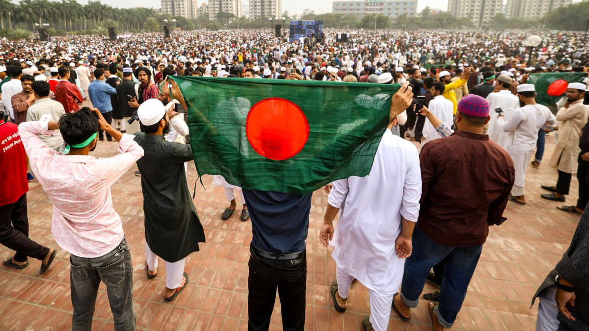 A mourner holds Bangladesh's national flag during the funeral of youth leader Sharif Osman Hadi in Dhaka on December 20. (AFP) A mourner holds Bangladesh's national flag during the funeral of youth leader Sharif Osman Hadi in Dhaka on December 20. (AFP)