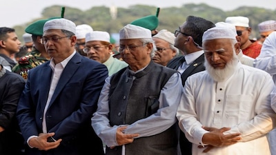 Muhammad Yunus offered his condolences at the funeral of Sharif Osman Hadi, a student leader who was shot in the head. Hadi's death has further fuelled anti-India demonstrations and anti-Hindu riots across the country. File image/Reuters