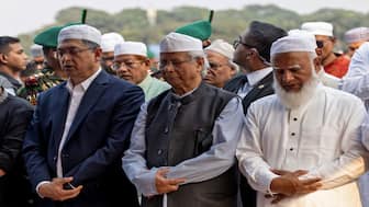 Muhammad Yunus offered his condolences at the funeral of Sharif Osman Hadi, a student leader who was shot in the head. Hadi's death has further fuelled anti-India demonstrations and anti-Hindu riots across the country. File image/Reuters
