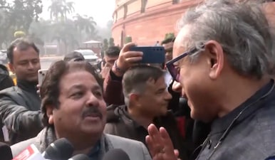 After fog abandoned Lucknow T20I, Congress MP Shashi Tharoor stopped BCCI VP Rajeev Shukla in Parliament. Image: PTI
