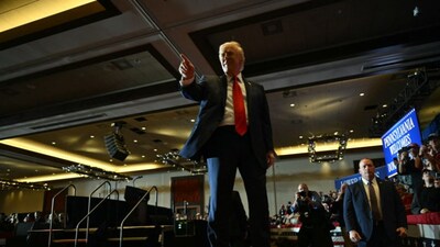 US President Donald Trump speaks with attendees after delivering remarks on the economy at the Mount Airy Casino Resort in Mount Pocono, Pennsylvania, on December 9. (AFP)