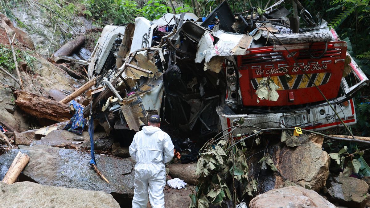 A forensic official inspects the site of a bus crash near the municipality of Remedios in Colombia’s Antioquia Department, where the vehicle veered off the road, killing 17 people and injuring 20 others, on December 14, 2025. (AFP) A forensic official inspects the site of a bus crash near the municipality of Remedios in Colombia’s Antioquia Department, where the vehicle veered off the road, killing 17 people and injuring 20 others, on December 14, 2025. (AFP)