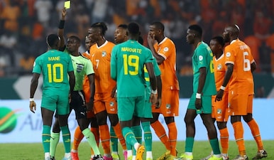 Football - Africa Cup of Nations - Round of 16 - Senegal v Ivory Coast - Charles Konan Banny Stadium, Yamoussoukro, Ivory Coast - January 29, 2024 Senegal's Sadio Mane is shown a yellow card by referee Pierre Atcho. Reuters