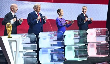FIFA President Gianni Infantino, US President Donald Trump, Mexico's President Claudia Sheinbaum and Canada's Prime Minister Mark Carney pose with their cards during the draw for the 2026 FIFA Football World Cup. Image: AFP