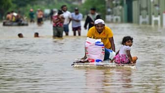 A man pushes a makeshift raft along a flooded street after heavy rainfall in Ambatale on the outskirts of Colombo. Sri Lanka has made an appeal for international assistance as the death toll from heavy rains and floods triggered by Cyclone Ditwah have risen substantially. AFP