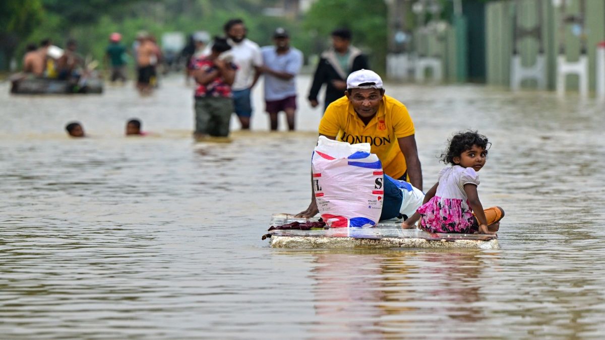 A man pushes a makeshift raft along a flooded street after heavy rainfall in Ambatale on the outskirts of Colombo. Sri Lanka has made an appeal for international assistance as the death toll from heavy rains and floods triggered by Cyclone Ditwah have risen substantially. AFP A man pushes a makeshift raft along a flooded street after heavy rainfall in Ambatale on the outskirts of Colombo. Sri Lanka has made an appeal for international assistance as the death toll from heavy rains and floods triggered by Cyclone Ditwah have risen substantially. AFP