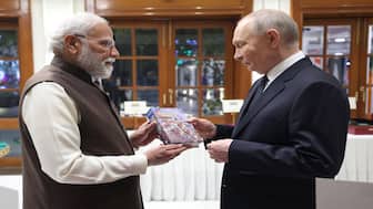 PM Modi gifts Vladimir Putin a Russian version of the Bhagavad Gita. Image Courtesy: @MEAIndia/X