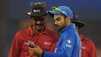 Virat Kohli shows a bottle thrown in the ground to the umpires. Image: AFP