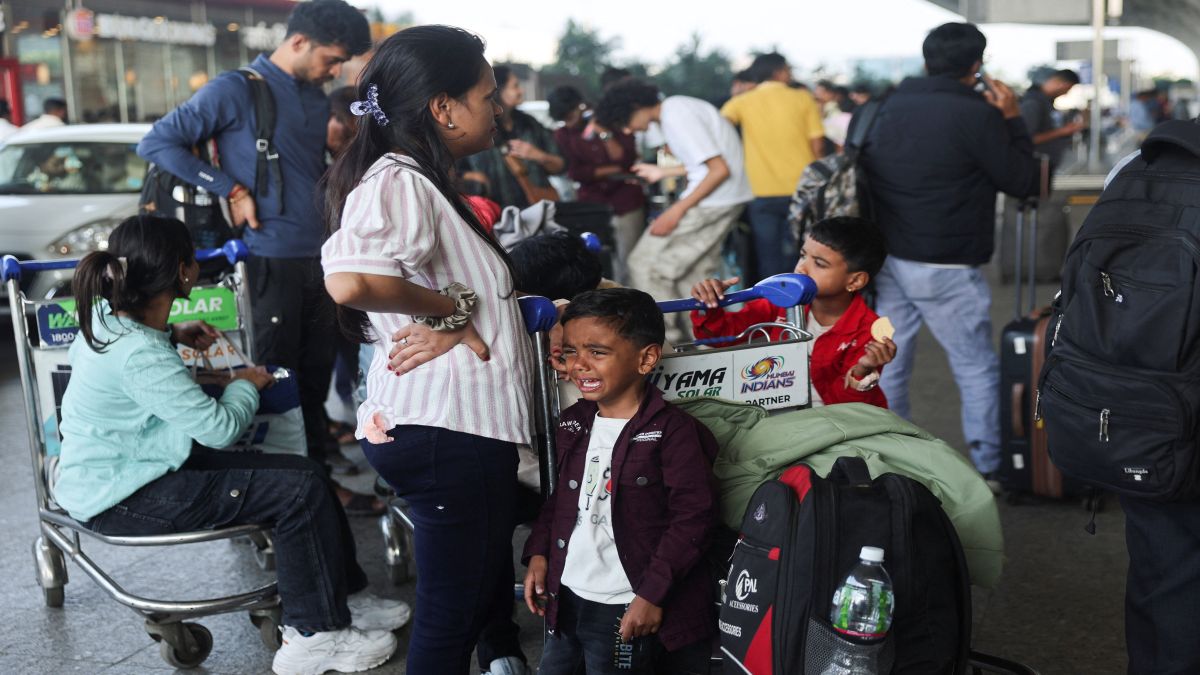 A boy cries as he waits with his family outside the Indigo Airlines ticketing counter at the Chhatrapati Shivaji Maharaj International Airport, after several IndiGo airlines flights were cancelled, in Mumbai, India. Reuters A boy cries as he waits with his family outside the Indigo Airlines ticketing counter at the Chhatrapati Shivaji Maharaj International Airport, after several IndiGo airlines flights were cancelled, in Mumbai, India. Reuters