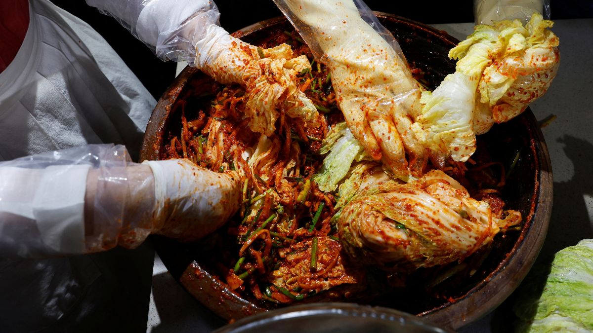 A kimchi grand master and her apprentices prepare kimchi at the Kimchi Culture Institute in Namyangju, South Korea, August 21, 2024. Representational Image/Reteurs A kimchi grand master and her apprentices prepare kimchi at the Kimchi Culture Institute in Namyangju, South Korea, August 21, 2024. Representational Image/Reteurs