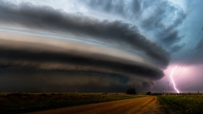 Supercell: A magnificent image of a supercell in New Mexico. Image Courtesy: Dennis Hualong Zhang/The 12th International Landscape Photographer of the Year