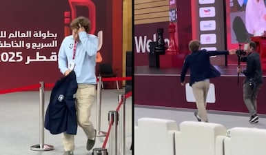 Screenshots from the video showing Magnus Carlsen pushing away the cameraman. X/FIDE