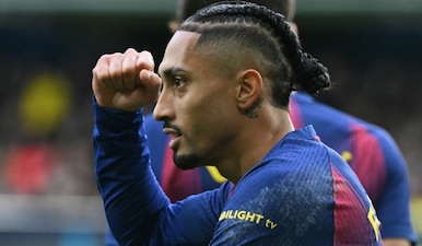 Barcelona's Brazilian forward #11 Raphinha celebrates scoring the opening goal during the Spanish league football match between Villarreal CF and FC Barcelona at La Ceramica Stadium in Vilareal on December 21, 2025. AFP